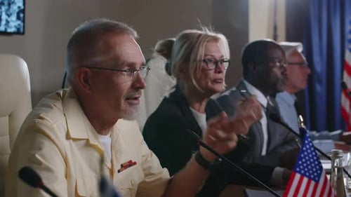 Panel Discussion in Workplace with American Flags