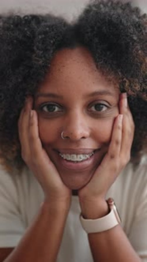 Smiling woman with braces and nose ring portrait