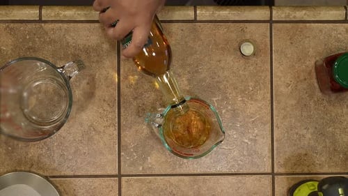 Measuring cooking sherry to add to a homemade soup recipe - overhead view WILD RICE SERIES