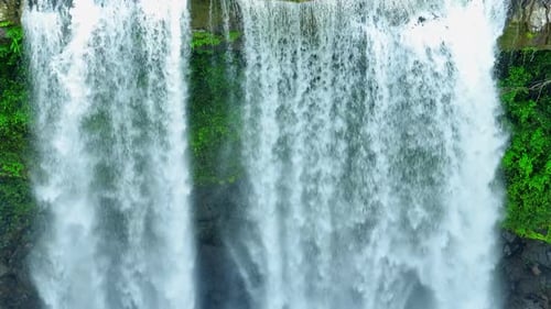 Stunning waterfall in a tropical forest from a bird's eye view.