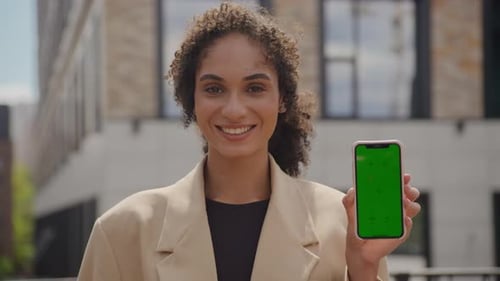 Businesswoman Showing Green Screen Smartphone