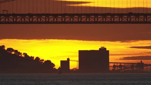 Sunset Behind Bridge Over Water