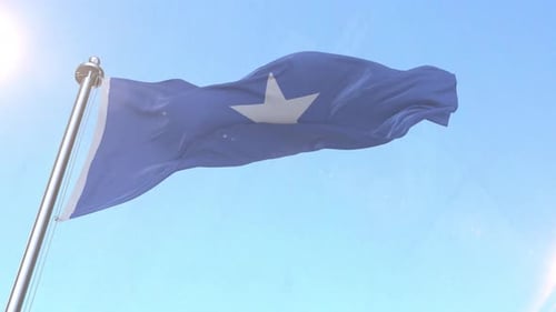 Realistic Somalia Flag Waving in Blue Sky
