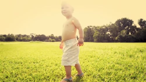 4k video footage of a little boy having fun in the park