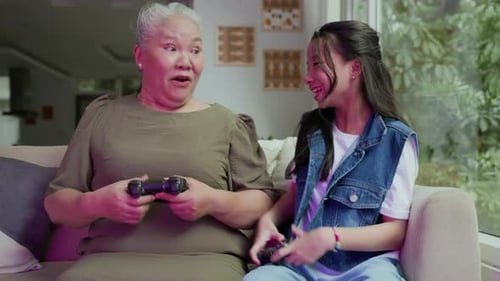 Grandmother and Grandchild Playing Video Games Together