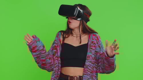 Excited Woman Using Virtual Reality Futuristic Technology Headset to Play Simulation 3D Video Game