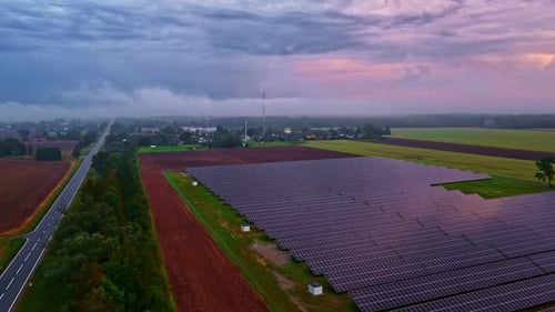 Large-scale solar farm park ground-mounted solar panels generating green electricity