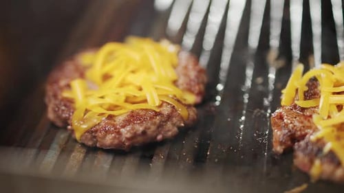 Street Food the Process of Cooking a Burger on the Grill Meat and Cheese are Grilled Baking Cheese