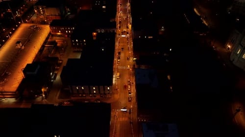 Street Of Sherbrooke City Illuminated With Lights At Nighttime In Canada - aerial pullback