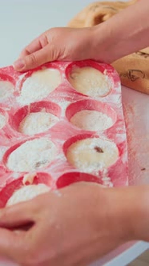 Preparing Muffins in a Baking Tray, Close Up