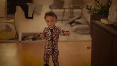 Adorable Infant Standing at Home