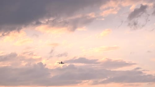 Huge Airplane Jet Take Off From Airport Landing Zone at Beautiful Sunset Clouds Sky Super Slow