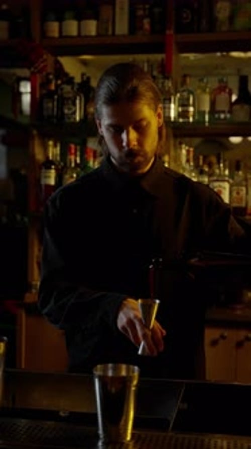 Closeup of Bartender's Hand with Jigger