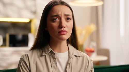 Woman Looking Distressed With Tears in Her Eyes