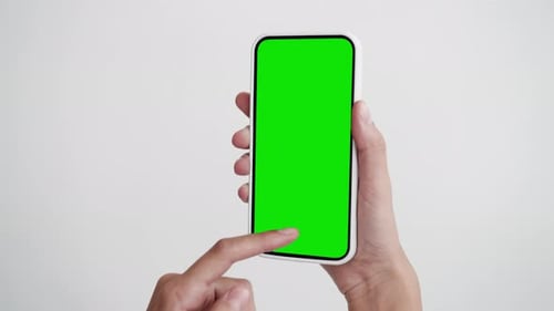 Young Woman Use Swipe and Tapping Touch Screen Phone with Green Chroma