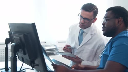 Doctor and Surgeon Talking Near Window Medical Workers in Hospital Office Day Light Healthcare
