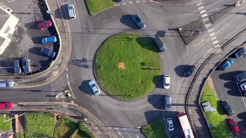 Overhead View of Vehicles Navigating a Roundabout in Birmingham, UK