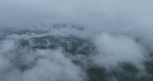 Aerial View of Fog Obscuring Mountain Range
