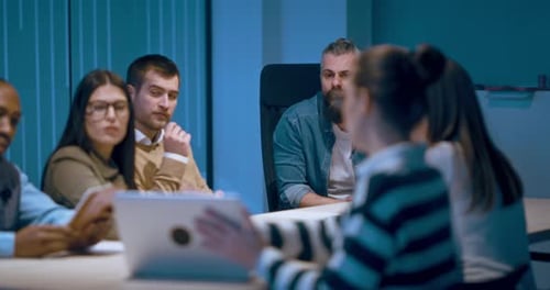 A Diverse Team of Young Professionals Collaborates in a Modern Office Conference Room Businesspeople