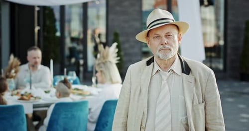Family Waving at Elegant Outdoor Urban Celebration