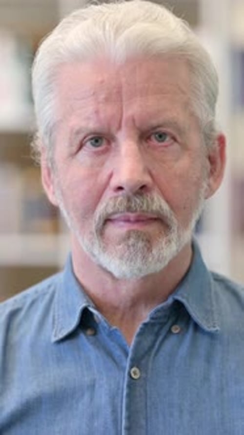 Portrait of Serious Adult Man with Gray Hair