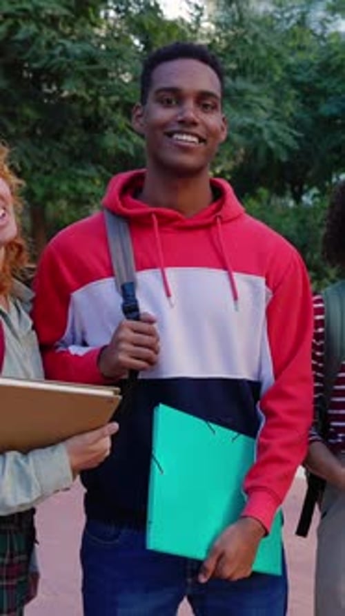 Multiracial Group of Teenage Student Friends Standing Together at Campus College