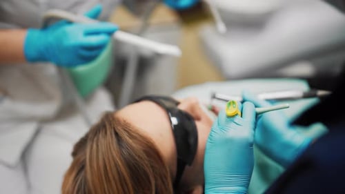 Healthcare and Medicine Woman in Stomatology Clinic Dentists Curing Teeth Professional Stomatologist