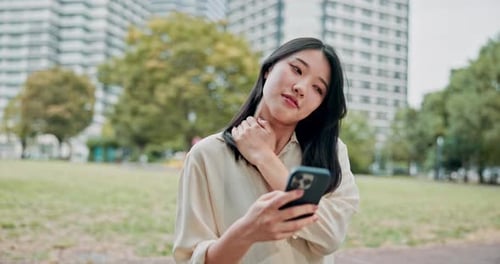 Asian woman, shoulder pain and city with phone for injury, muscle tension or stress at park