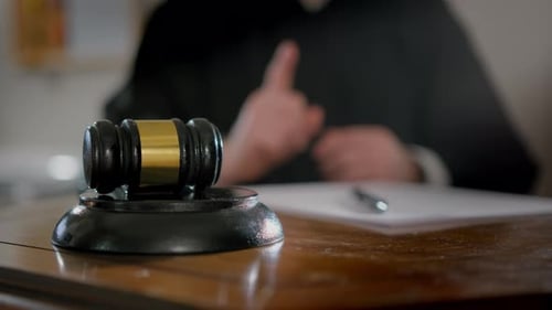 Close Up Footage of Judge's Hand with Wooden Judge Gavel Slow Motion Footage