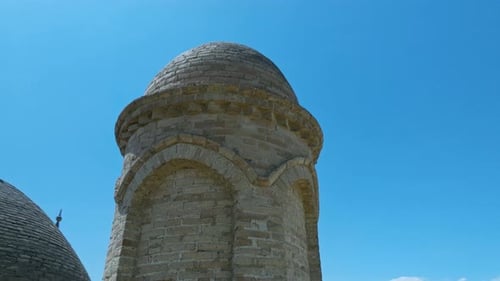 Brick Minaret On The Facade Of Arystan Bab Mausoleum In Kazakhstan. drone pullback orbit