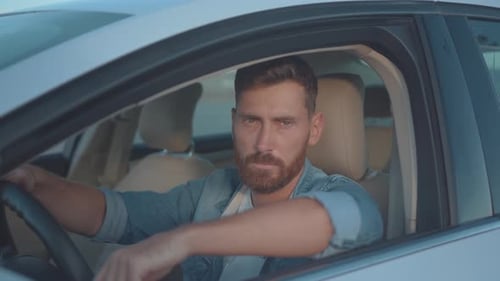 Man With Beard Inside White Car During Daytime