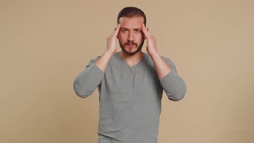 Young Man Massaging Temples