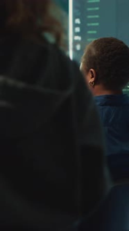 Woman Coder Collaborating in Tech Workplace