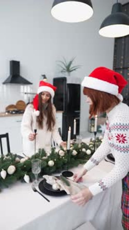 Two Female Friends Decorate the New Year's Table