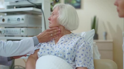 Senior Woman Gets Checkup From Doctor in Hospital