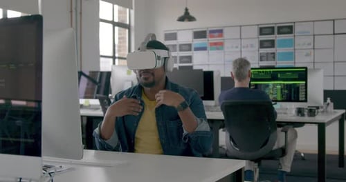 Engineer on Videocall using VR headset in Metaverse in an Office