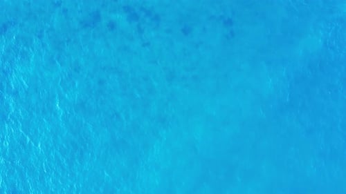 Sea surface aerial footage. Ocean ripple water background.