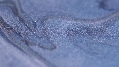 Rippling Glittery Fluid in Close Up