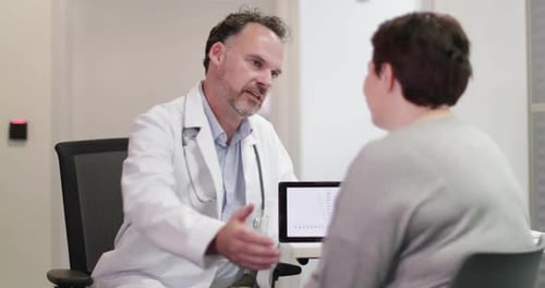 Doctor Explains Test Results to Female Patient