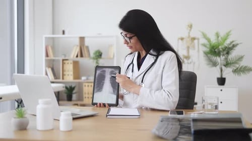 Doctor Explains X-Ray During Telemedicine Consultation