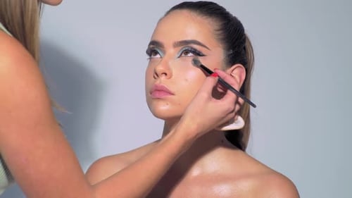 Woman Gets Makeup Applied by Makeup Artist