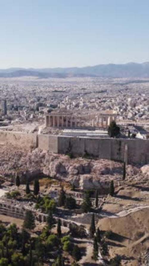 Acropolis and Parthenon in Athens city aerial view. Circle vertical video