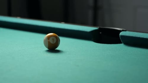 Sinking Nine Ball into Side Pocket in Slow Motion