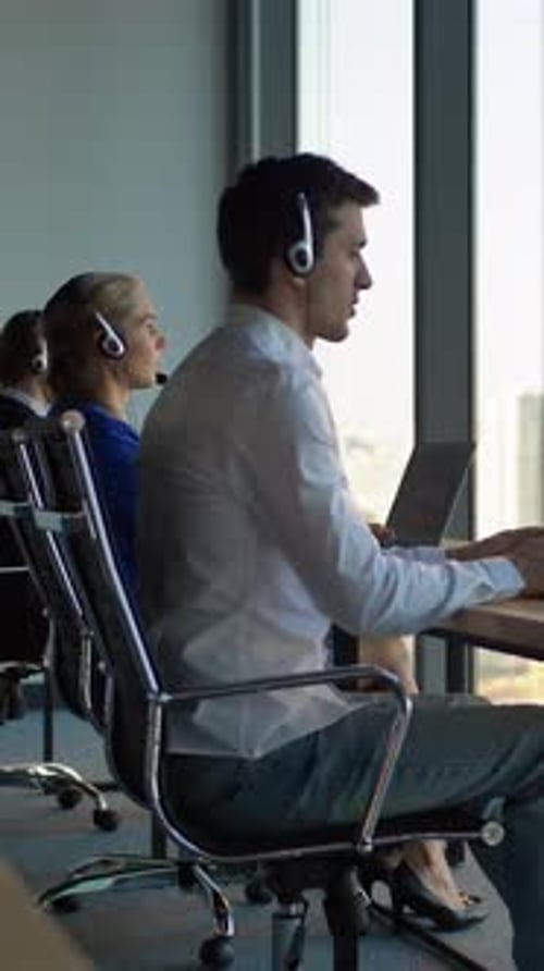 Vertical of Caucasian Boss Businessman with Tablet PC in Call Center