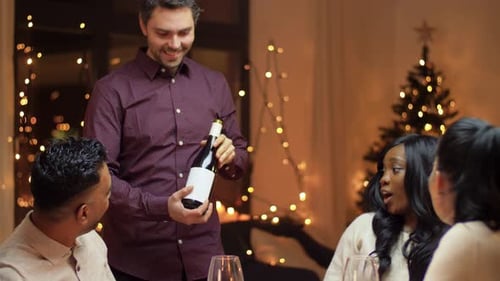 Friends Celebrate with Wine at Festive Dinner Party