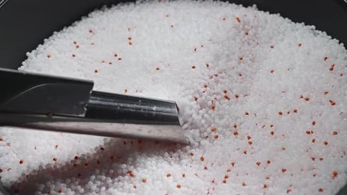 Plastic Granules are Sucked From the Tank Into the Production Machine for Thermoforming of Products
