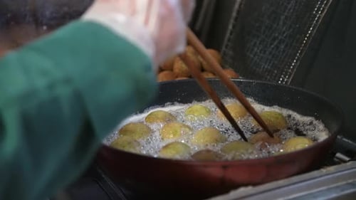 Falafel Balls Being Fried in Oil