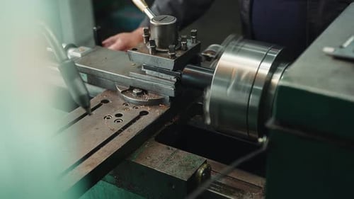Industrial Machine Rotating Metal Rod in Workshop