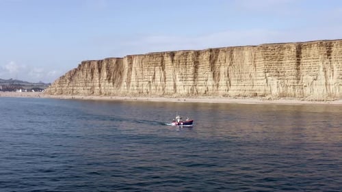 Commercial Fishing Vessel Heading out to Sea in the UK
