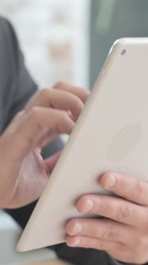 Close up of Businessman Hand Using Tablet PC, vertical video